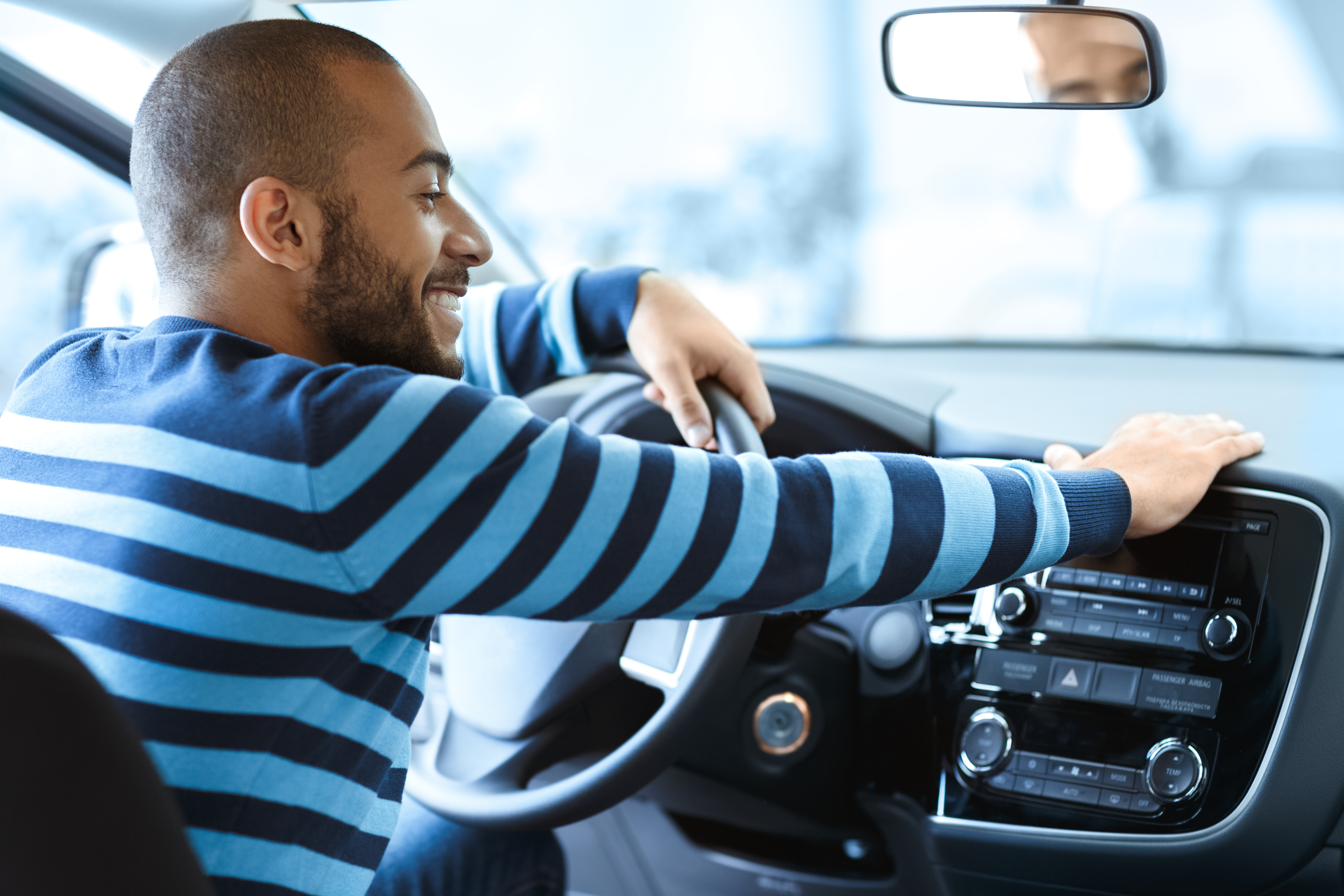 Happy Man Sitting In His Car